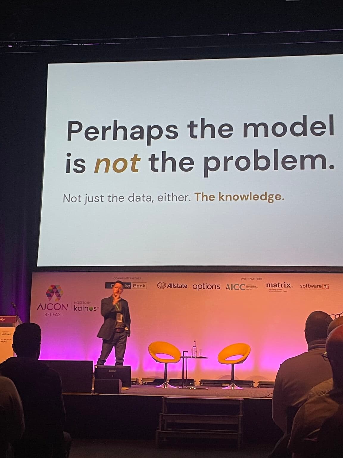Ger Perdisatt speaking on stage at AICON