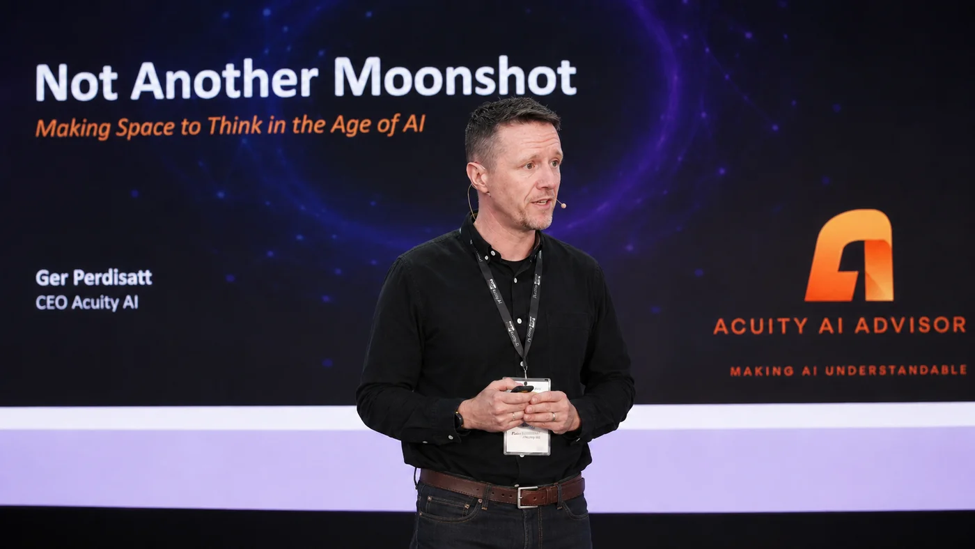 Ger Perdisatt speaking on stage at AICON